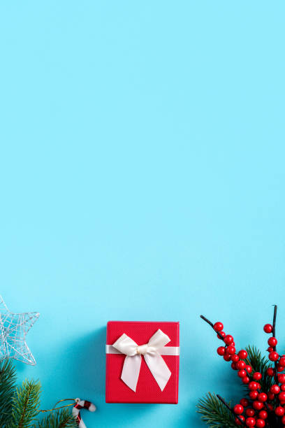 istock Christmas background design concept with gift box and fir tree branch decoration 1358785604