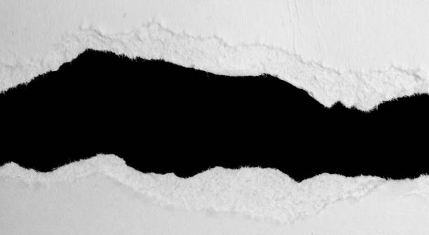 istock a white piece of paper on a black isolated background 1358786241