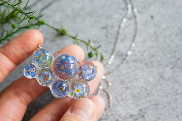 istock Real flowers in epoxy resin, jewelry 1358789427