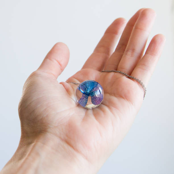 istock Real flowers in epoxy resin, jewelry 1358791031