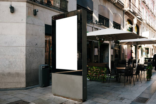 istock Blank billboard in a city street 1358791956