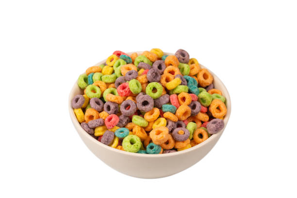 istock Colorful rings cereal spill out into a bowl. Breakfast. Isolated. 1358793016