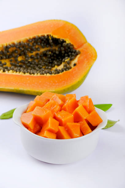 istock Fresh orange Papaya on white dish and papaya slice. Space for text 1358796701