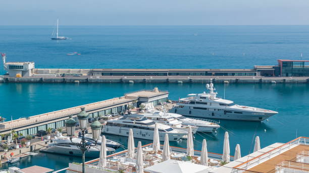 Mediterranean sea, boats and Monaco yacht club timelapse in Monte Carlo district, Monaco Mediterranean sea, boats and Monaco yacht club timelapse in Monte Carlo district, Monaco. Top view at sunny summer day monaco photos stock pictures, royalty-free photos & images