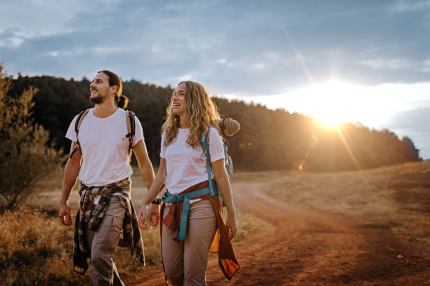 istock Couple enjoying hike at sunrise 1358798061
