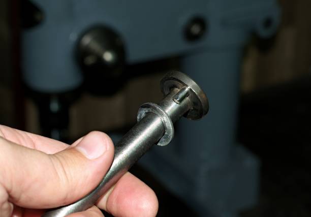 istock Holds a special bolt in his hand. 1358798900