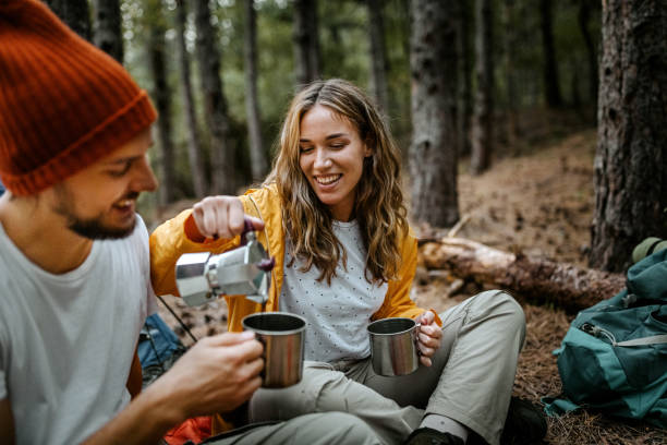 istock Young women serving coffee during hiking 1358800054