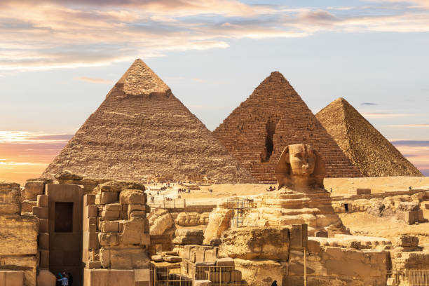 istock Ruins of Egypt Necropolis with the Sphinx by the Pyramids, Cairo, Egypt 1358800105