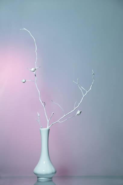 istock Still life - winter nostalgia with dry branche in a white vase 1358801491