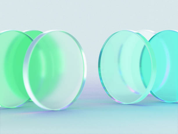 istock 3D rendered round shapes in semi-transparent material on a green background. Illustration of abstracts, geometry, or minimalism. Visualization of illusion and backgrounds. 1358801559