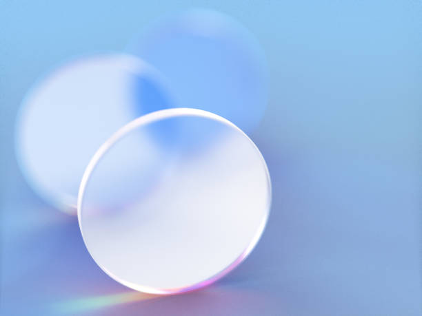istock 3D rendered round shapes in semi-transparent material on a blue background. Illustration of abstracts, geometry, or minimalism. Visualization of illusion and backgrounds. 1358801562