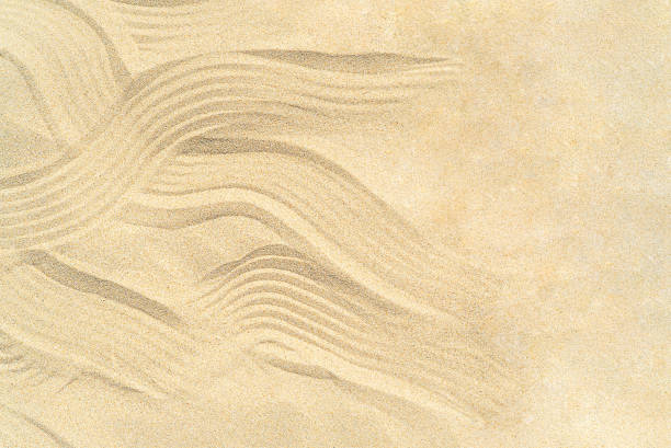 istock Drawing of waves on the sand 1358801788
