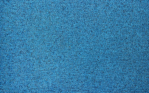 close up texture of blue fabric showing detail of stitch for vintage background. denim background. texture of blue jeans. close up texture of blue fabric showing detail of stitch for vintage background. denim background. texture of blue jeans. jersey fabric photos stock pictures, royalty-free photos & images