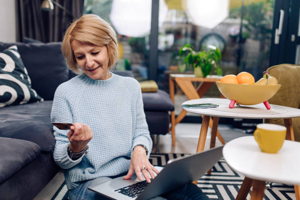 istock Woman shopping online from her home 1358802436