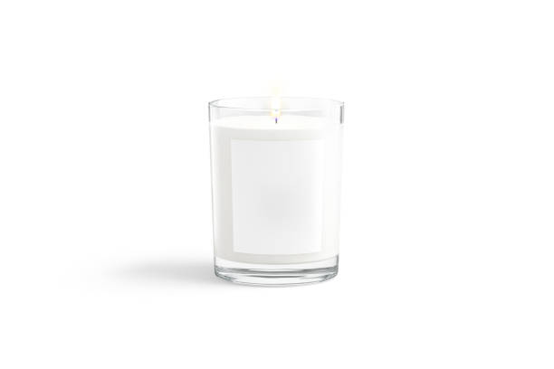 istock Blank white pillar candle in glass jar with label mockup 1358803542