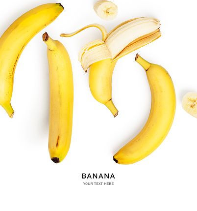 Banana fruit creative layout isolated on white background. Healthy eating and food concept. Tasty fruits composition. Flat lay, top view. Design element