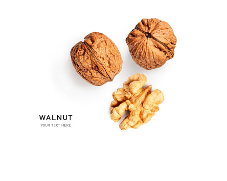 Walnut creative layout isolated on white background. Healthy eating and dieting food concept. Nuts composition and design element. Top view, flat lay