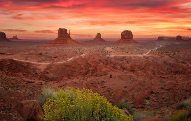 istock Monument Valley with red vibrant sunset 1358805319