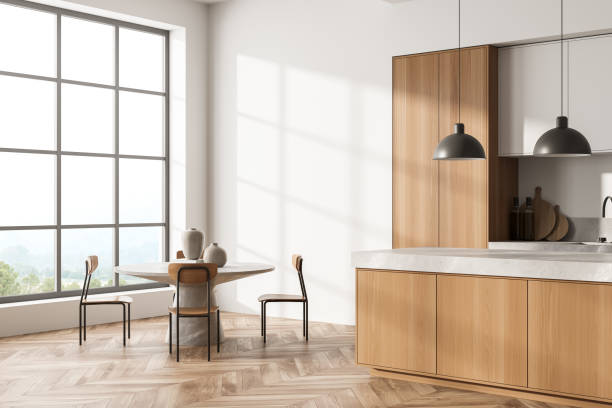 istock Light kitchen interior with eating table and chairs on parquet floor 1358809205