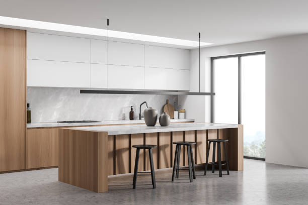 istock Breakfast bar and linear light in minimalist white and grey kitchen 1358811239