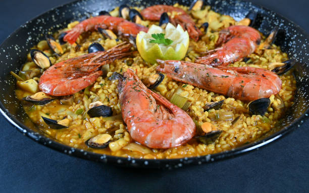 istock Seafood and rice paella with prawns close up 1358812347