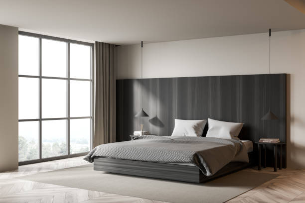 istock Light bedroom interior with bed on carpet and window with countryside 1358812443