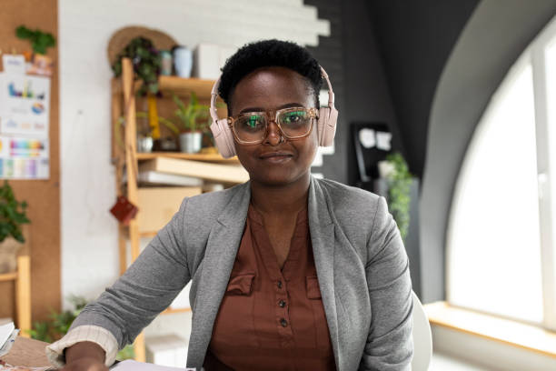 istock Cheerful young female entrepreneur on a video conference with a client 1358812832