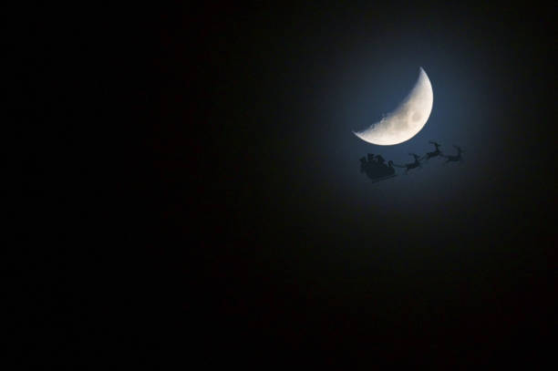 istock Santa's Sleigh And Reindeer's  In Front of  Moon 1358812932