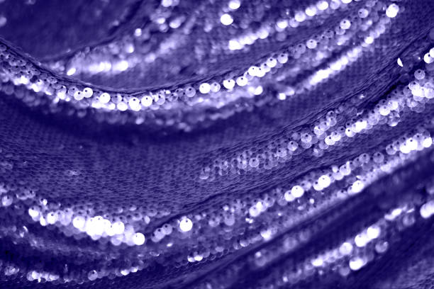 istock Festive sequin background in trendy purple 2022. 1358814989