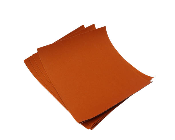 istock Sheets of sand paper isolated on white background 1358816896