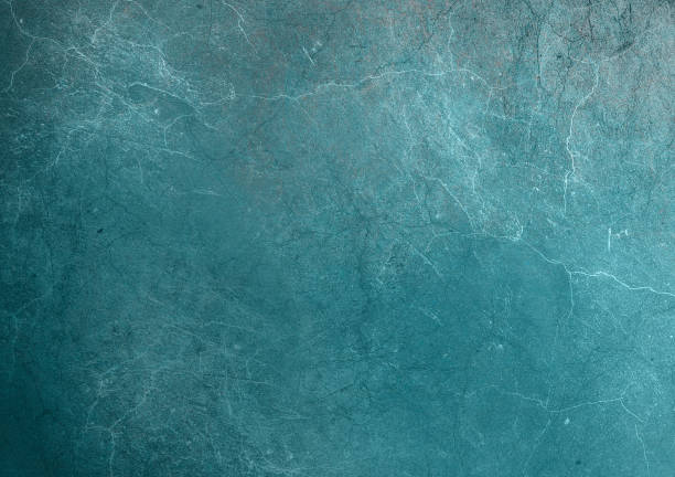 istock Turquoise blue background Grimy marbled texture Scuff concrete wall Rough scratched textured surface 1358817215