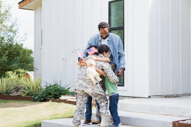 istock Family welcomes returning female soldier 1358817996