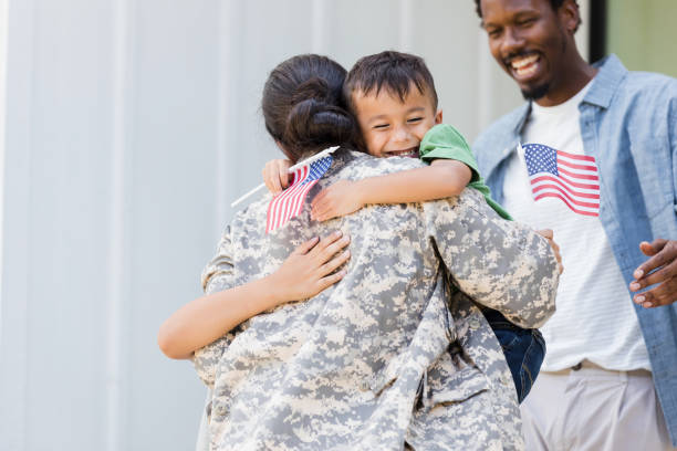 istock Family overjoyed to see returning soldier mom 1358818015