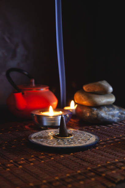 istock Zen background, incense lit with lit candles 1358818464