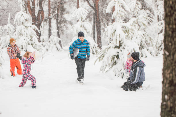istock Family heaving fun on a winter day 1358818681