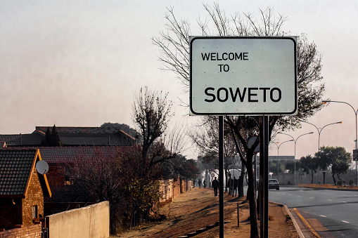 Welcome to SOWETO -  banner or road sign at the entrance of Soweto, in the suburb of Johannesburg. Greeting on the information road sign at the entrance to Soweto.   South Africa,