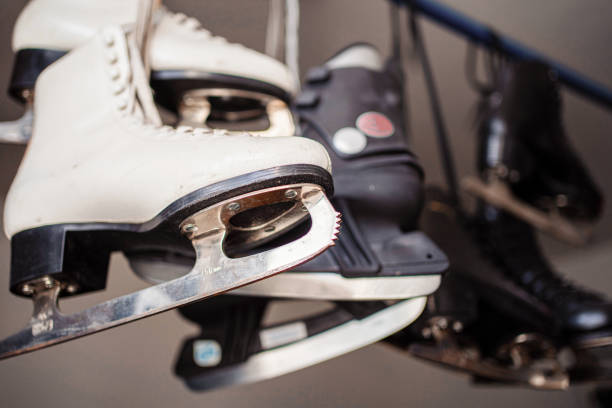 women and men's skates with laces hanging - ice hockey ice ice skating sport imagens e fotografias de stock