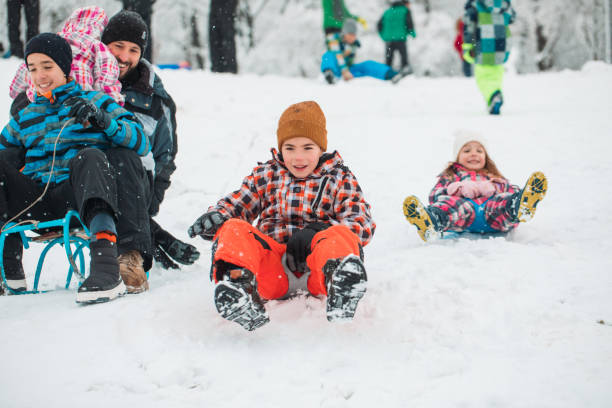 istock Family having good time during sledding 1358823022