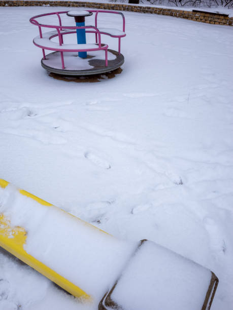istock Children's playground covered with snow 1358823043