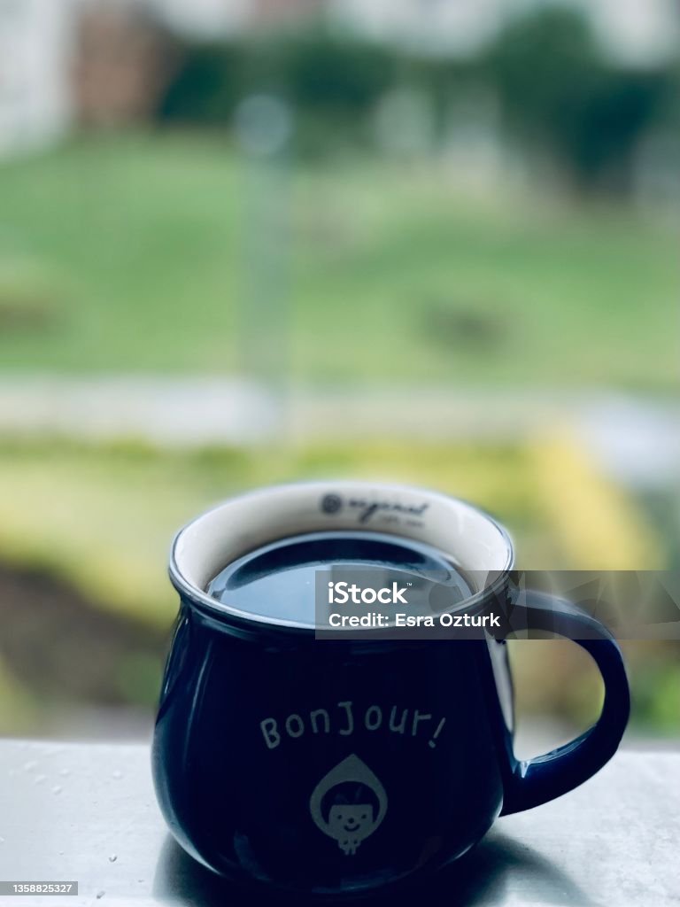 Bonjour - good morning coffee Bonjour - good morning coffee in blue cup Backgrounds Stock Photo