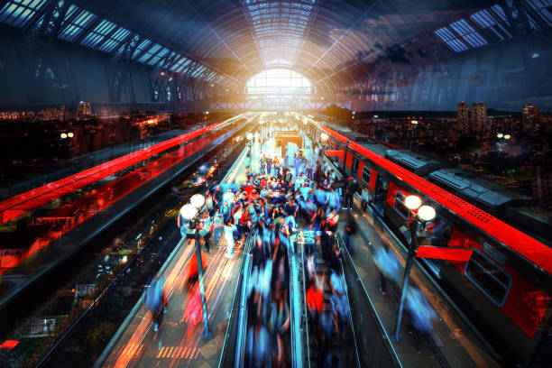 istock Abstract city night blurred light double exposure moving train and people background. Concept image. 1358825613