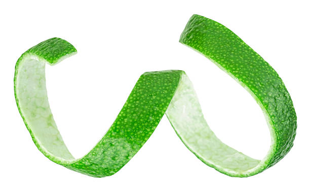 istock Fresh lime fruit peel isolated on a white background. Curly lime peel twist. 1358828905