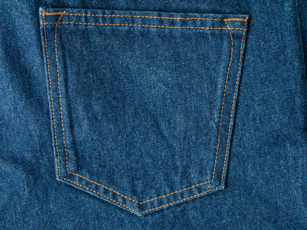 istock Back pocket on denim trousers close-up, jeans background 1358829197
