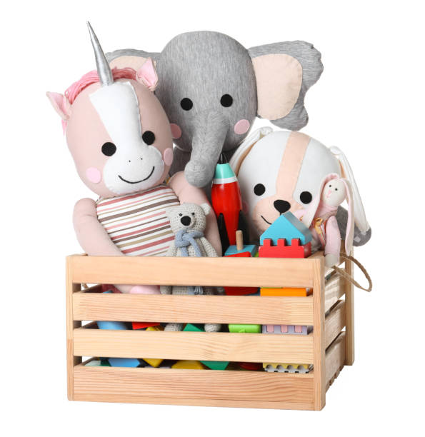 istock Wooden crate with different toys isolated on white 1358831688