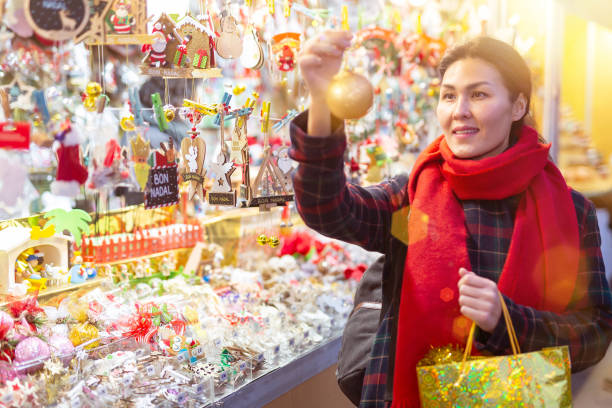 istock Woman purchasing christmas decorations 1358832318