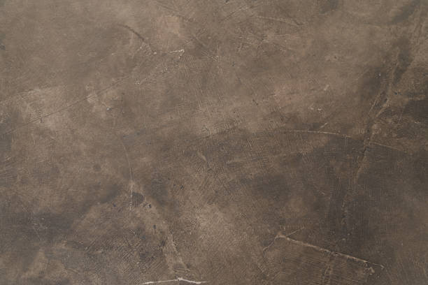 istock Seamless brown concrete texture. Stone wall background 1358832489