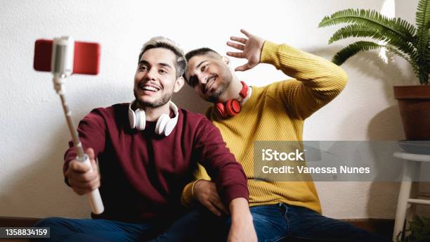 Gay Couple Streaming Online On Social Media With Mobile Phone Lgbt Technology Trendy Concept Focus On Left Man Face Stock Photo - Download Image Now