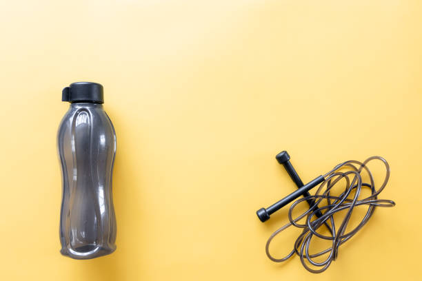 istock Flat lay composition with sports equipment on yellow background. 1358838122