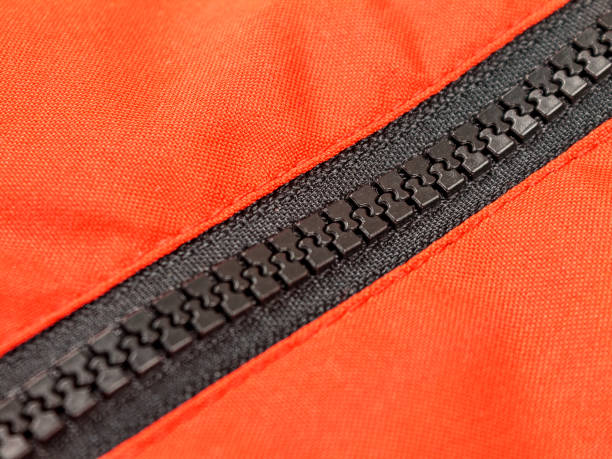 istock A zipper, zip, fly, zip fastener, formerly known as a clasp locker, is a commonly used device for binding the edges of an opening of fabric or other flexible material 1358839053