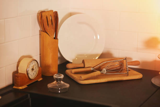 istock KItchen cutlery with wooden kitchen spatula, plate and vintage clock 1358839062